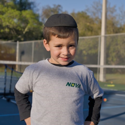 Boy in a NOVA T-shirt at an afternoon class