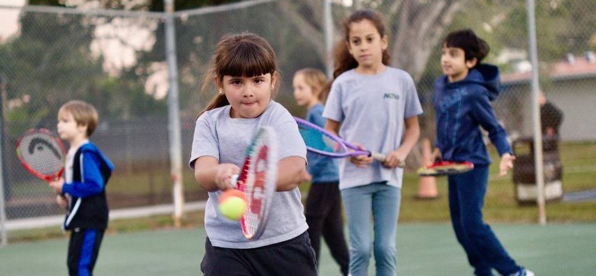 Social Tennis — Ages 7-13 · Orange & Green balls